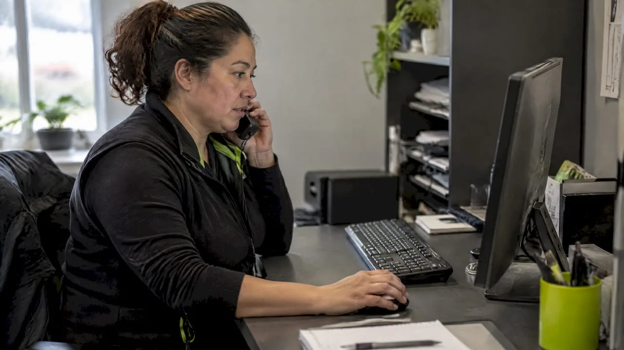 Business owner checking appointment availability during call